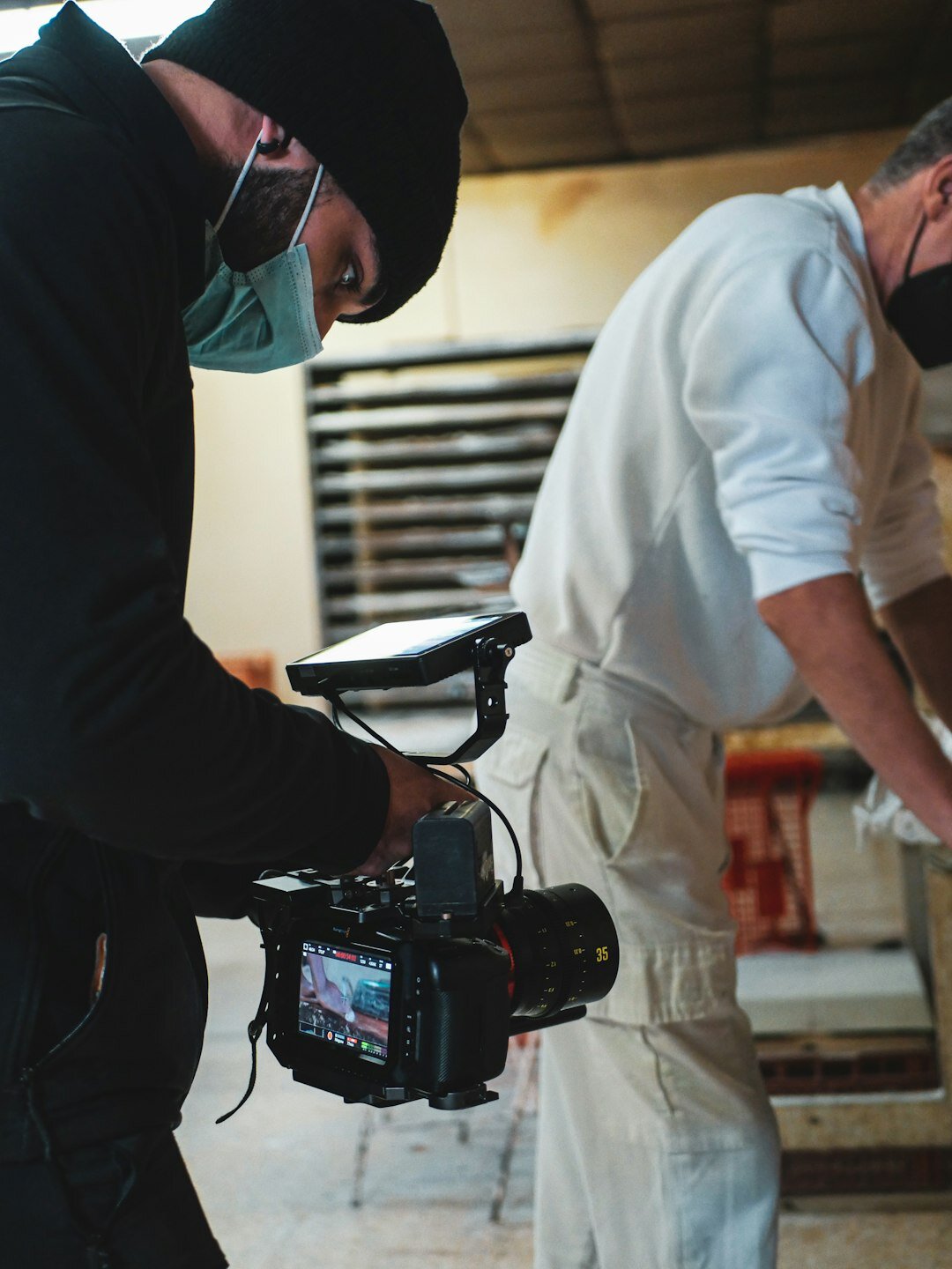 Diverse team of documentary producers reviewing footage on a monitor