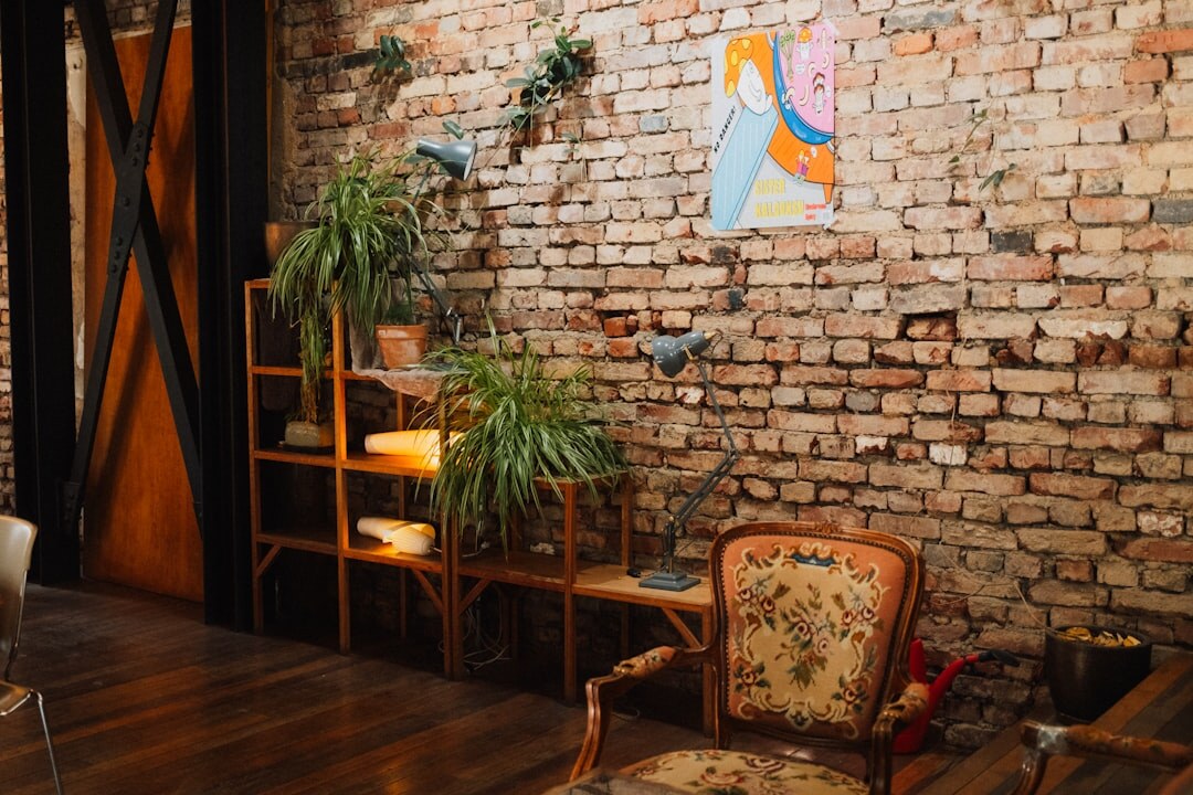 Bright creative studio office with exposed brick wall and film equipment